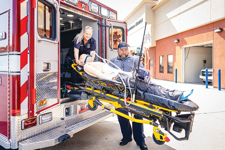 Paramedic Lisa Broombaugh and Lt. Kevin Boyer use a medical training mannequin to practice procedures.